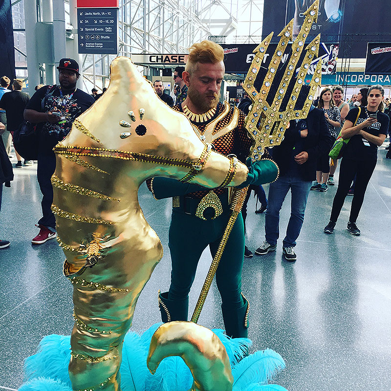 Comicon Merman checking his phone